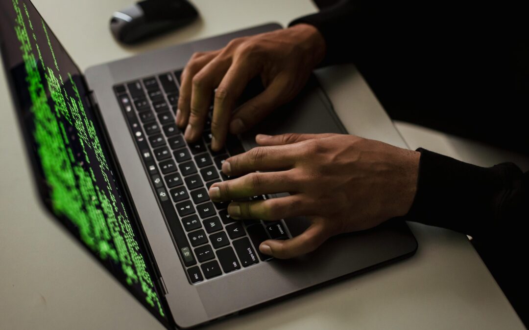 crop-cyber-spy-hacking-system-while-typing-on-laptop