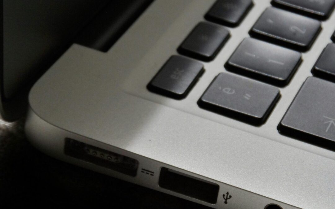 Free Detailed view of a silver laptop showing keyboard and multiple ports. Stock Photo
